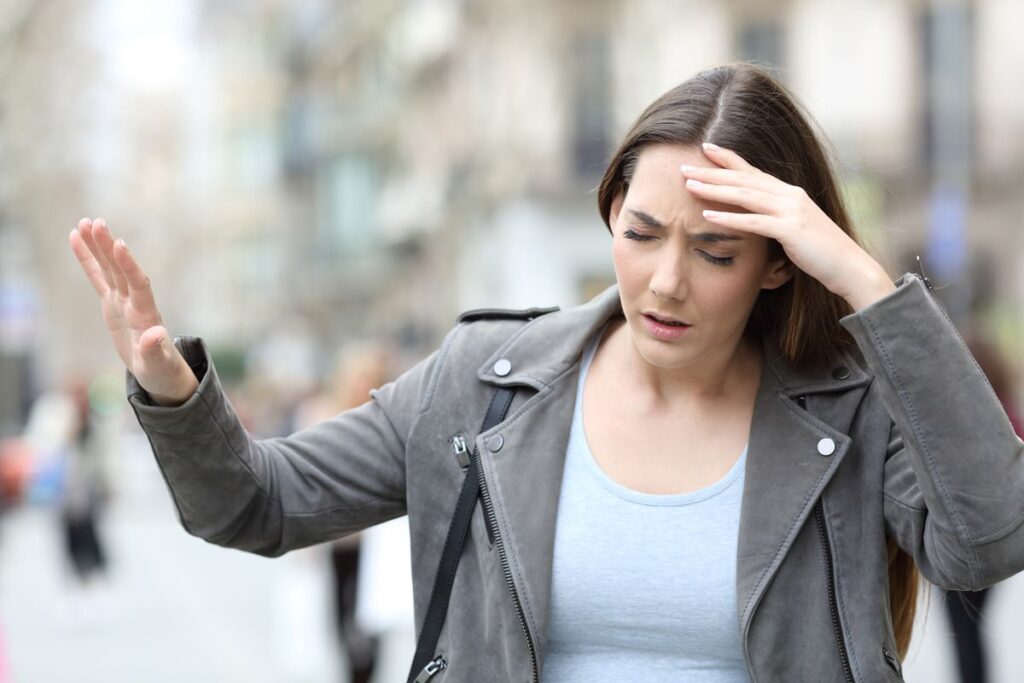 Man experiencing blurred vision, dizziness, and balance difficulties, highlighting early neurological warning signs requiring medical evaluation.