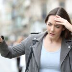 Man experiencing blurred vision, dizziness, and balance difficulties, highlighting early neurological warning signs requiring medical evaluation.
