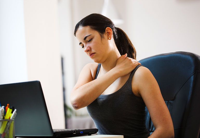 Woman suffering from chronic spine pain despite medication due to an underlying untreated spinal condition